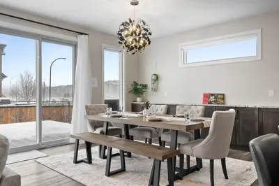 a dining room with a table and chairs at Large Luxury Home Featuring Entertain Room with Karaoke Air Hockey and Pool Table in Calgary