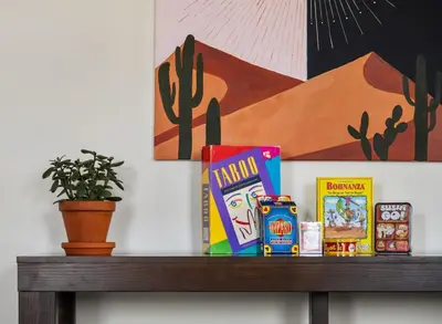 a shelf with snacks and a plant on it at Cozy Modern Pet Friendly Homes in Calgary