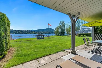 a patio with a table and chairs and a gazebo at Lakefront Suite on Shawnigan Lake in Shawnigan Lake