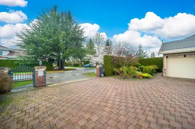 a brick driveway in front of a house with a garage at Guest suite in Richmond in Richmond