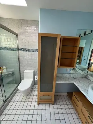 a bathroom with a shower and a toilet and a sink at Luxurious and quiet room in Vancouver's West End in Vancouver