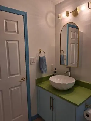 a bathroom with a sink and a mirror at Blue Villa by the Sea in Sechelt