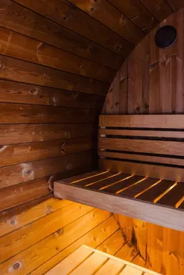 a sauna with a bed in a wooden room at NordicSauna 3 Ensuite baths TheYellowDoorRetreat in Edmonton
