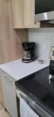 a kitchen counter with a blender on top of it at A3 Home in Secord in Edmonton
