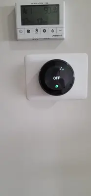 a clock on top of a white wall at A3 Home in Secord in Edmonton