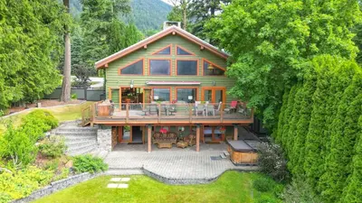 an overhead view of a house with a large deck at Custom Built Home on the Beach in Nelson