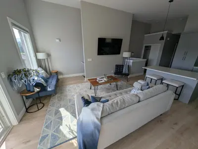 a living room with a couch and a table at Lakeview Hideaway in Victoria