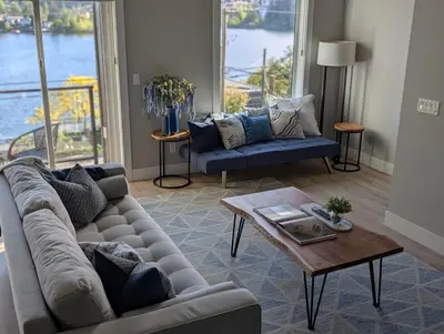 a living room with a couch and a coffee table at Lakeview Hideaway in Victoria
