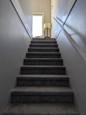 a stairway leading up to a door in a house at Lakeview Hideaway in Victoria