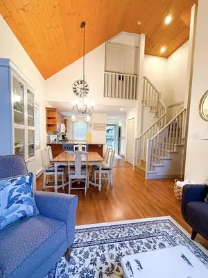a dining room and kitchen with a table and chairs at Oceanside Resort 3 BED 2 BATH with Indoor Pool and Hot Tub in Parksville