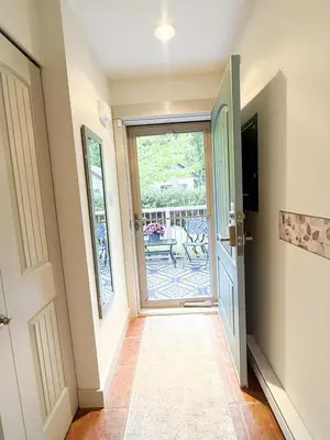 a hallway with a door leading to a patio at Oceanside Resort 3 BED 2 BATH with Indoor Pool and Hot Tub in Parksville