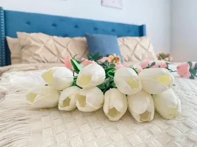 a group of white flowers on a bed at The Downtown Oasis - A Spacious Family Friendly 3 Bedroom House Close to Everything in Edmonton