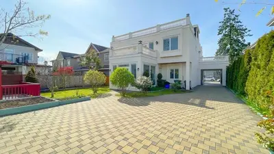 a large white house with a driveway at #3 Room in Richmond