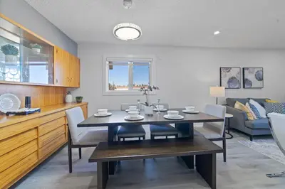 a kitchen and dining room with a table and chairs at Bungalow Southgate University WEM Rogers Place Saville & Snow Resort in Edmonton
