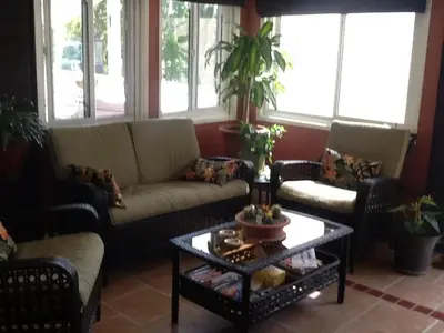 a living room with couches and a coffee table at Vintage Merlot Bed and Breakfast in Oliver