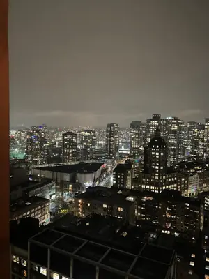 a view of a city at night with lights at Cozy Gastown condo with a view! in Vancouver