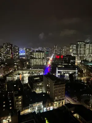 a view of a city at night with lights at Cozy Gastown condo with a view! in Vancouver