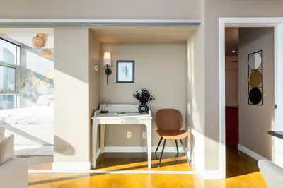 a room with a desk and a chair at Summit Mountain & Skyline Views Beltline in Calgary