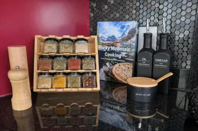a display of spices and wine bottles on a counter at Summit Mountain & Skyline Views Beltline in Calgary