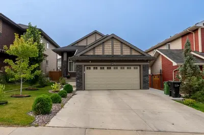 a house with a garage in a driveway at Anna Suite Rental in Edmonton