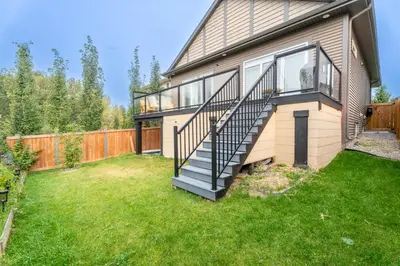 a house with a staircase in a yard at Anna Suite Rental in Edmonton