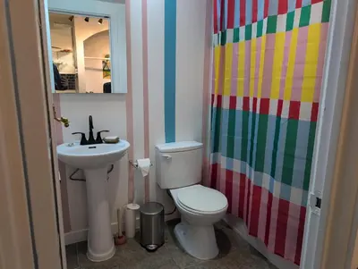 a bathroom with a toilet and a sink at One Bedroom Suite in perfect location Vancouvers Mount Pleasant in Vancouver
