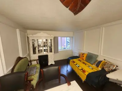 a living room with a couch and chairs at One Bedroom Suite in perfect location Vancouvers Mount Pleasant in Vancouver