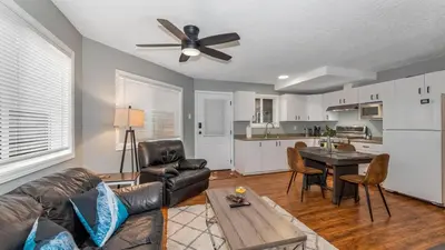 a living room with a couch and a table at Knockan Hill Rentals - Ground Floor Suite in Victoria