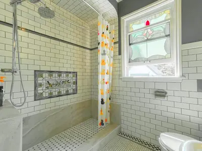 a bathroom with a shower and a sink at Cozy Private Bedroom Suite in UBC Campus in Vancouver