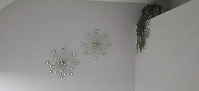 a couple of lights hanging on a wall at Glacier Comfort Living Suite in Calgary