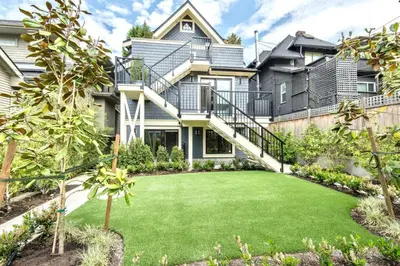 a large house with a lawn in front of it at Kitsilano Retreat at Private 3 Bed with Parking and BBQ in Vancouver