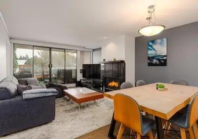 a living room with a table and a couch at Whistler Village Retreat, Private Hot Tub & Sauna in Whistler