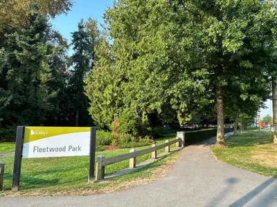 a sign for a firewood park next to a fence at Cozy Dreamscape in Surrey