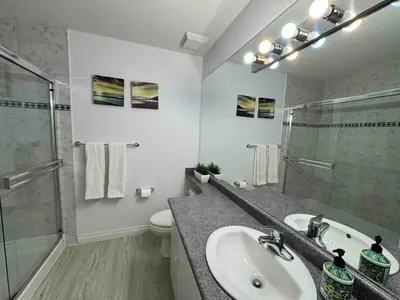 a bathroom with a sink and a shower and a toilet at Adorable, 2 Bedrooms in West Vancouver in West Vancouver