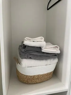 a stack of towels sitting on top of a basket at Central Vally Private House in Abbotsford