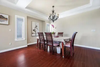 a dining room with a table and chairs at Coquitlam Heights Private Room in Coquitlam