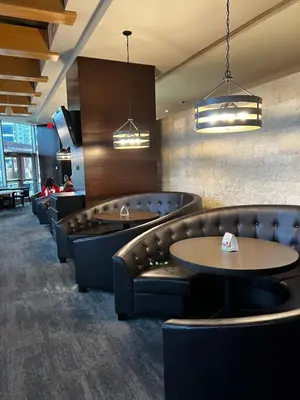 a restaurant with couches and tables and chairs at Calgary&Downtown&BMO Centre & Parking in Calgary