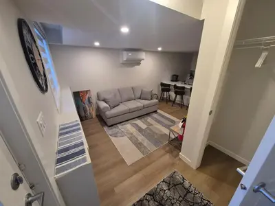 a living room with a couch and a table at Superb 1-Bdr Apt in New Condo in Calgary