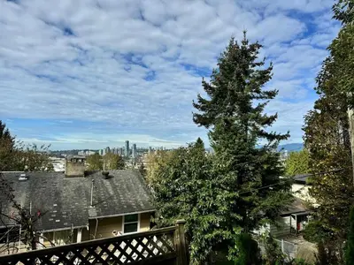 a christmas tree in the yard of a house at 3 Bed - Best View in Town! in Surrey