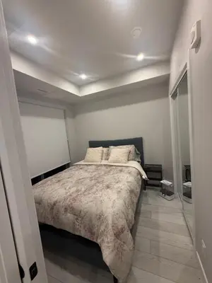 a bedroom with a large bed in a room at Calgary place in Calgary