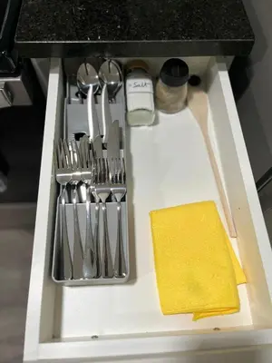 a drawer in a kitchen with utensils at One bedroom private entrance suite in Edmonton