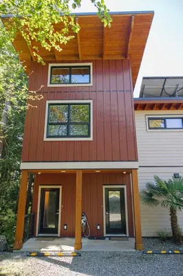 a house with a red roof at The Inlet Haven - 2 Bedroom on the Inlet in Ucluelet