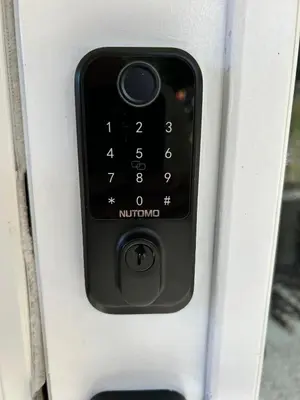 a close up of a remote control in a machine at Cozy and Relaxing Private Getaway Free Parking in Nanaimo