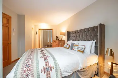 a bedroom with a large bed with a large headboard at Marquise 610 by Outpost Whistler in Whistler