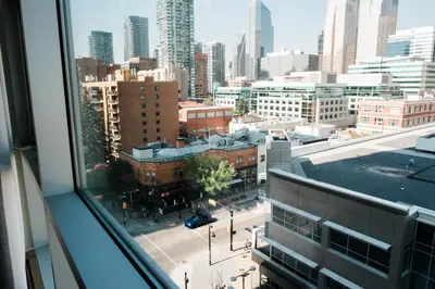 a view of a city from a window at City Views Walk to Calgary Tower and Stampede in Calgary