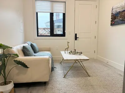 a living room with a couch and a table at South surrey Secondary Suite with Kitchen in Surrey