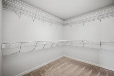 a white room with white shelves and a window at Luxury 7 Bedroom House with Karaoke Sound System and 100 Inch Projector in Calgary