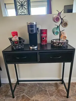 a black table with a coffee maker and other items on it at The Onyx Suite In Inglewood Minutes To DT in Calgary