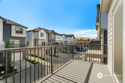 a balcony in a apartment complex with houses at Luxurious Designer Finished Home in Calgary