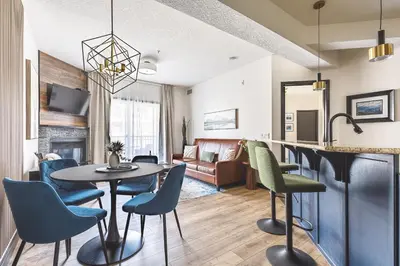 a living room with a table and chairs at Westwinds - Funky Basecamp in the Rockies in Canmore